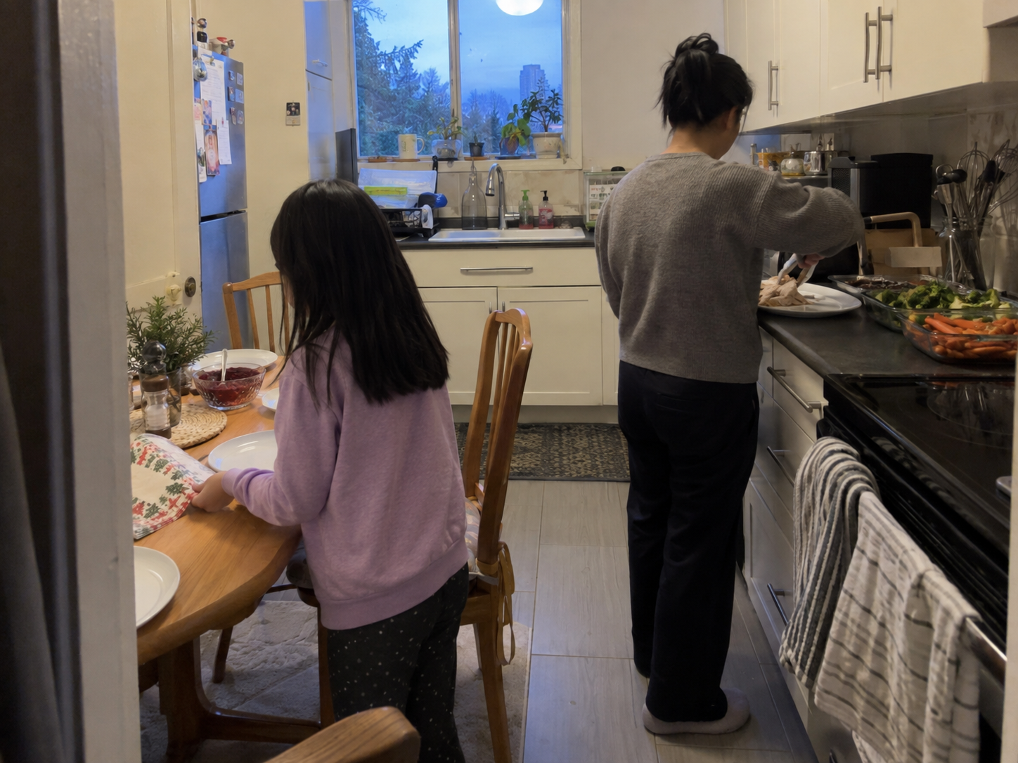 A family preparing a turkey dinner together in a home kitchen
