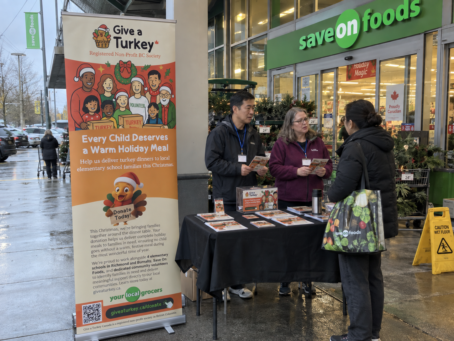 Volunteers at a fundraising table outside a grocery store